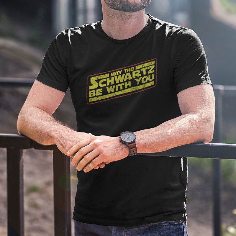 80s tees featuring the words May The Schwartz Be With You. Black retro t shirt by Dodo Tees.