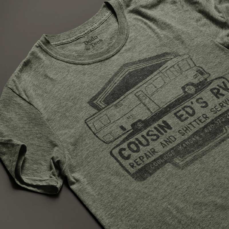 close up view of Holiday shirt featuring cousin eddies RV repair logo