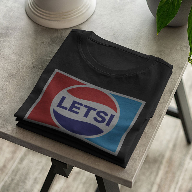 close up of novelty t shirt with letsi graphic
