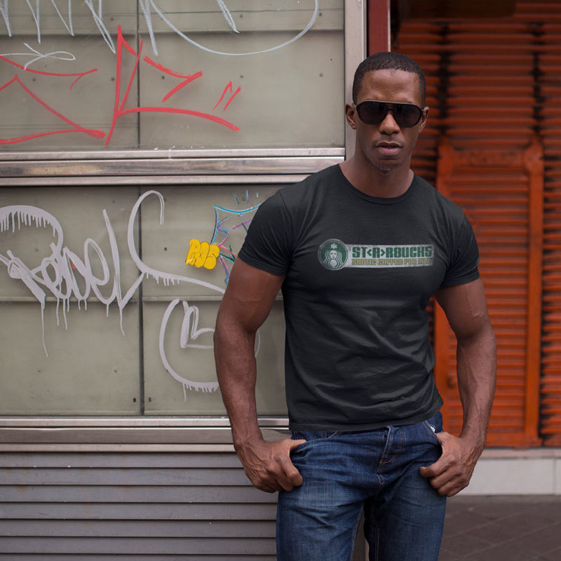 man in city wearing cult movie t shirt with exotic coffee for men logo in black