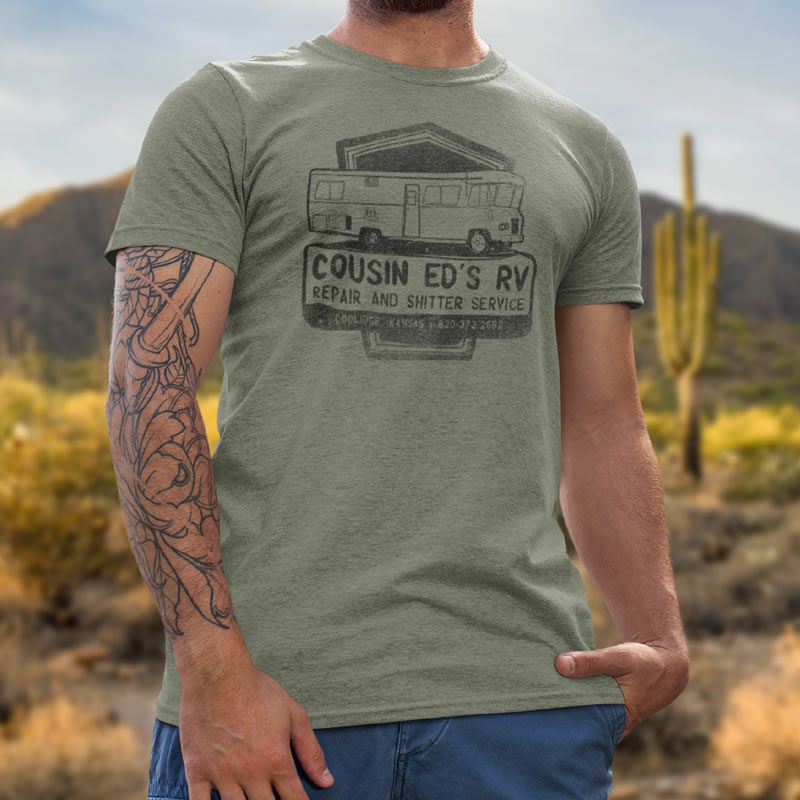 close up of model wearing heather Olive Christmas Vacation shirts featuring Cousin Eddie's RV