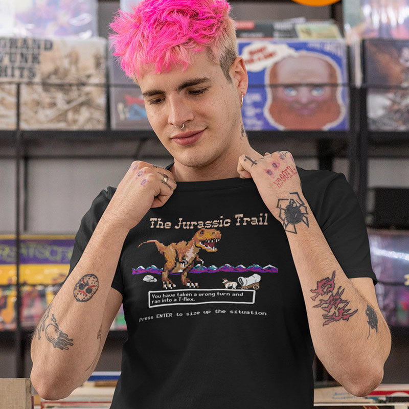 Funny 8-bit dinosaur shirt with T-Rex attacking wagon. Jurassic Trail parody for retro gamers