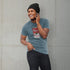 Guy wearing Heather Blue gamer T-Shirt. A Stylish Pop Culture Mashup from Dodo Tees.