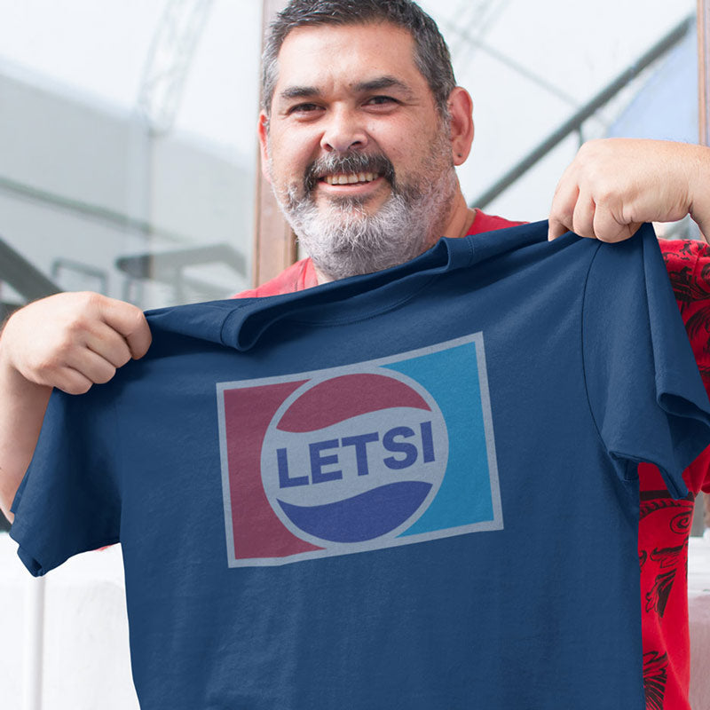 smiling man showing off gift for dad letsi t shirt