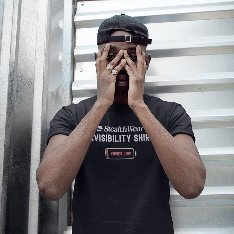Man wearing the Stealth Wear Invisibility Shirt: Power Low graphic tee. Image showing off side-seamed construction of print quality of the Dodo Tees premium mens t shirts.