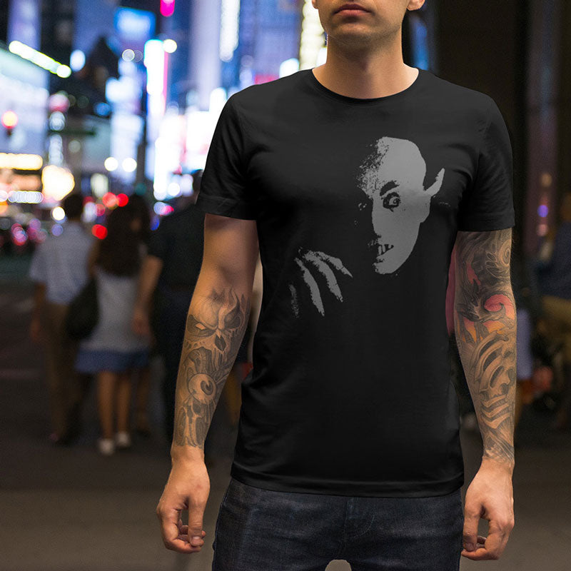 man on street wearing halloween graphic tees with nosferatu graphic
