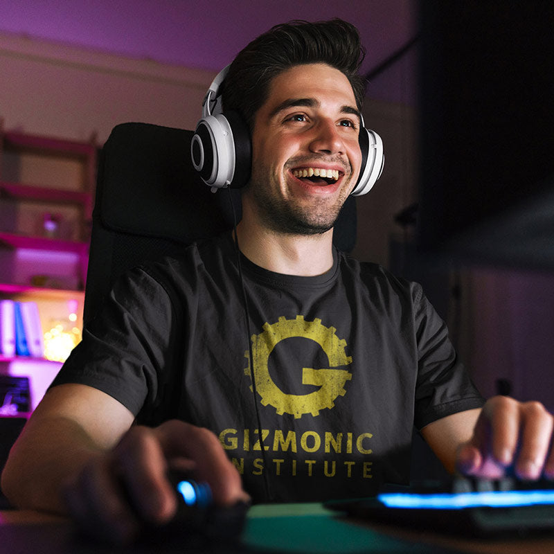 gamer at computer wearing movie t shirt with gizmonic institute grunge logo