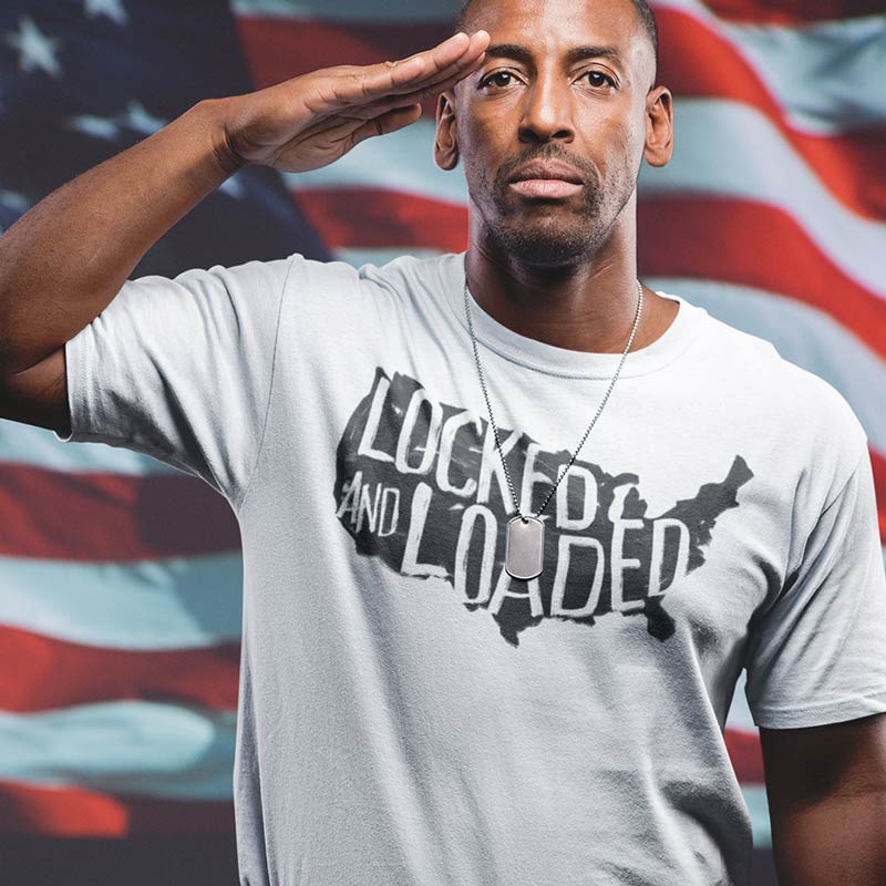 man wearing patriotic shirt saying locked and loaded on USA map
