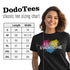 model wearing pride shirt with spray paint heart graphic that says I love everyone in classic black