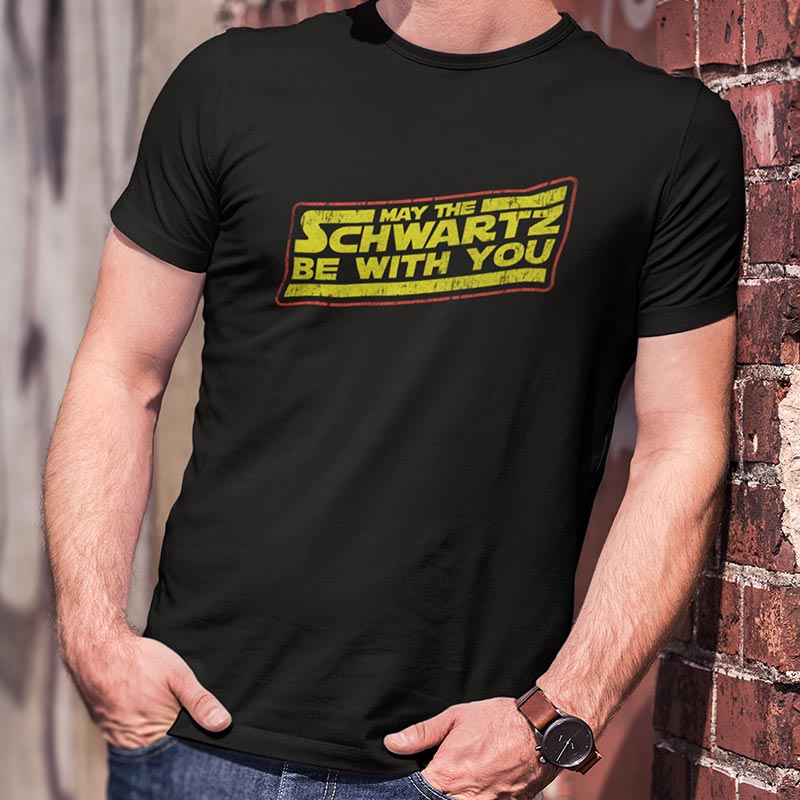 Retro movie t shirts featuring the words May The Schwartz Be With You. Black 80s tees.