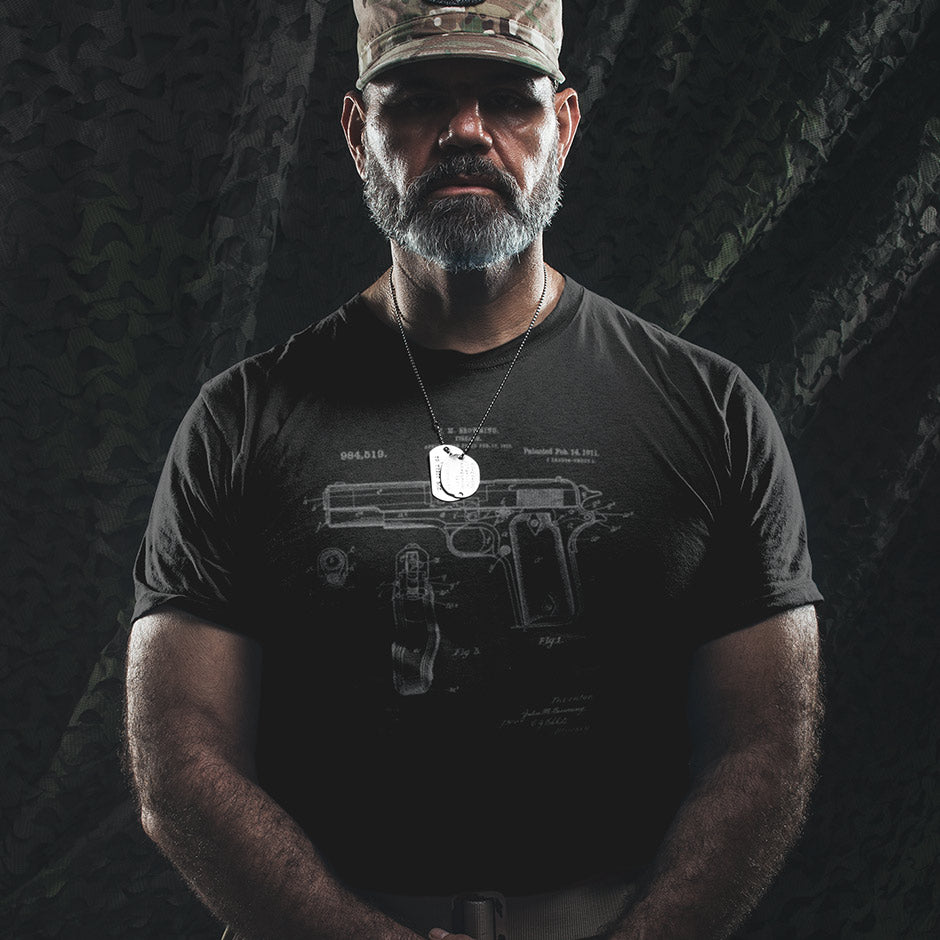 Military Man wearing the 1911 shirt in black featuring the US patent in grey. The tactical t shirts make great gifts for gun lovers.