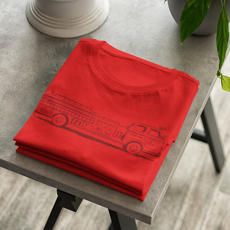 folded firefighter shirt with firetruck illustration 