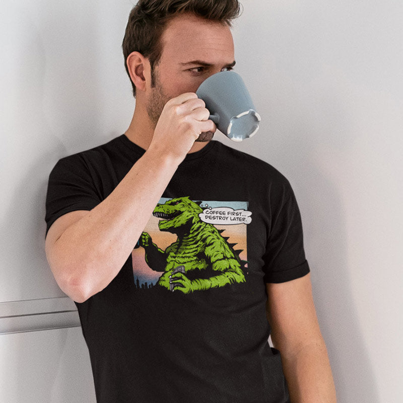 guy drinking coffee wearing a Funny shirt featuring godzilla like monster drinking coffee saying coffee first destroy later