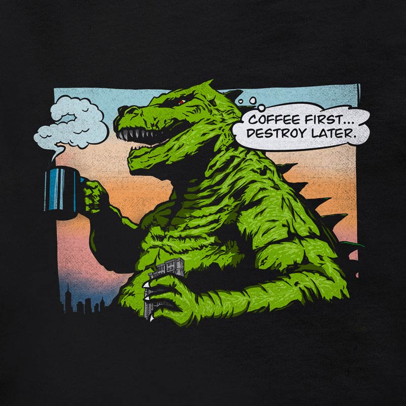 Funny shirt with godzilla like monster drinking coffee and a thought bubble saying coffee first destroy later by Dodo Tees.