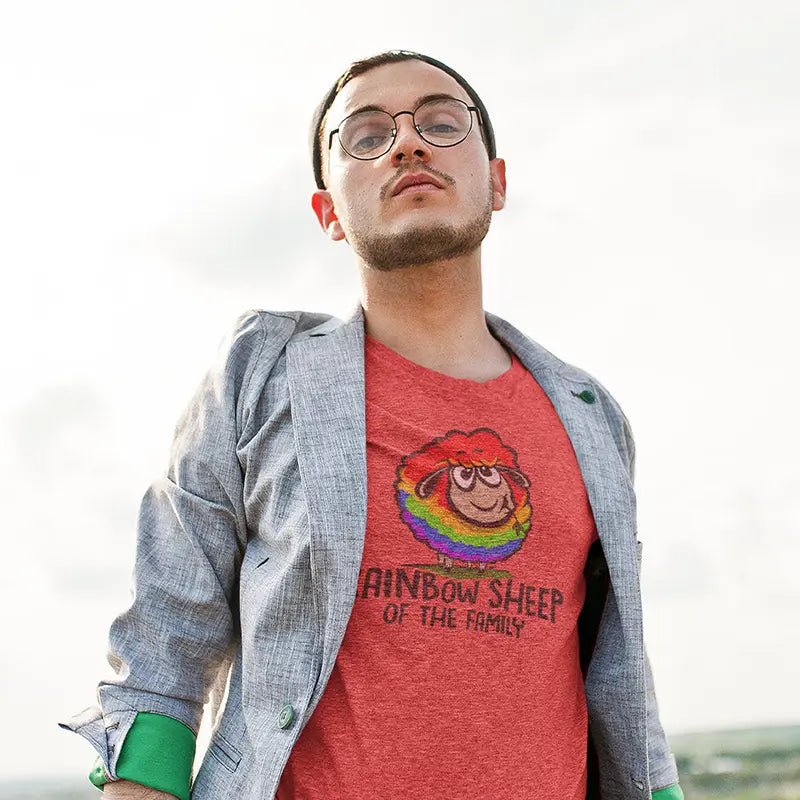 man in blazer wearing pride gear rainbow sheep of the family t shirt in heather red