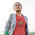 man in blazer wearing pride gear rainbow sheep of the family t shirt in heather red