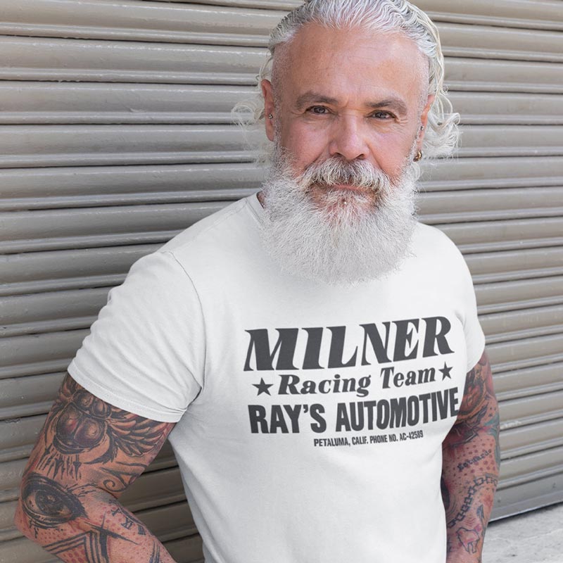 man in front of garage wearing automotive apparel with milner racing team logo