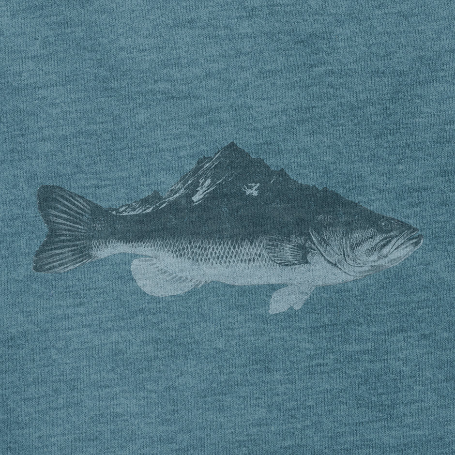 close up of bass fishing shirt with unique illustration of a bass fish morphing into a mountain. The Dodo Teesour fishing apparel is designed for those who demand both comfort and style.