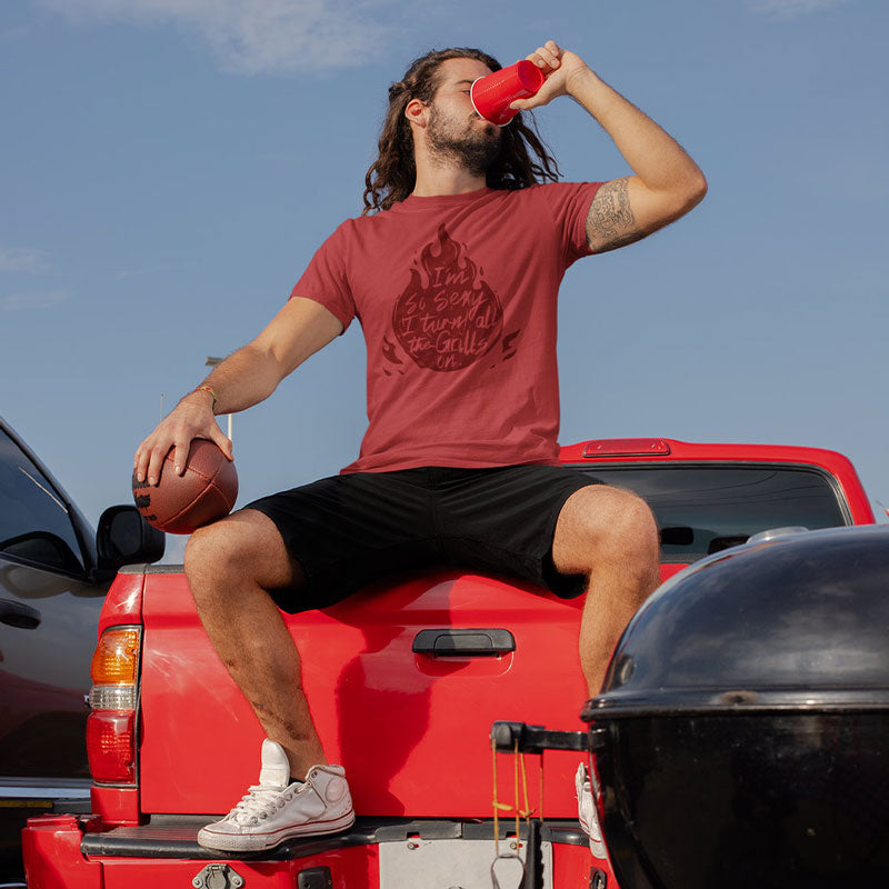 man at tailgate wearing bbq shirt with I'm so sexy i turn all the grills on illustration