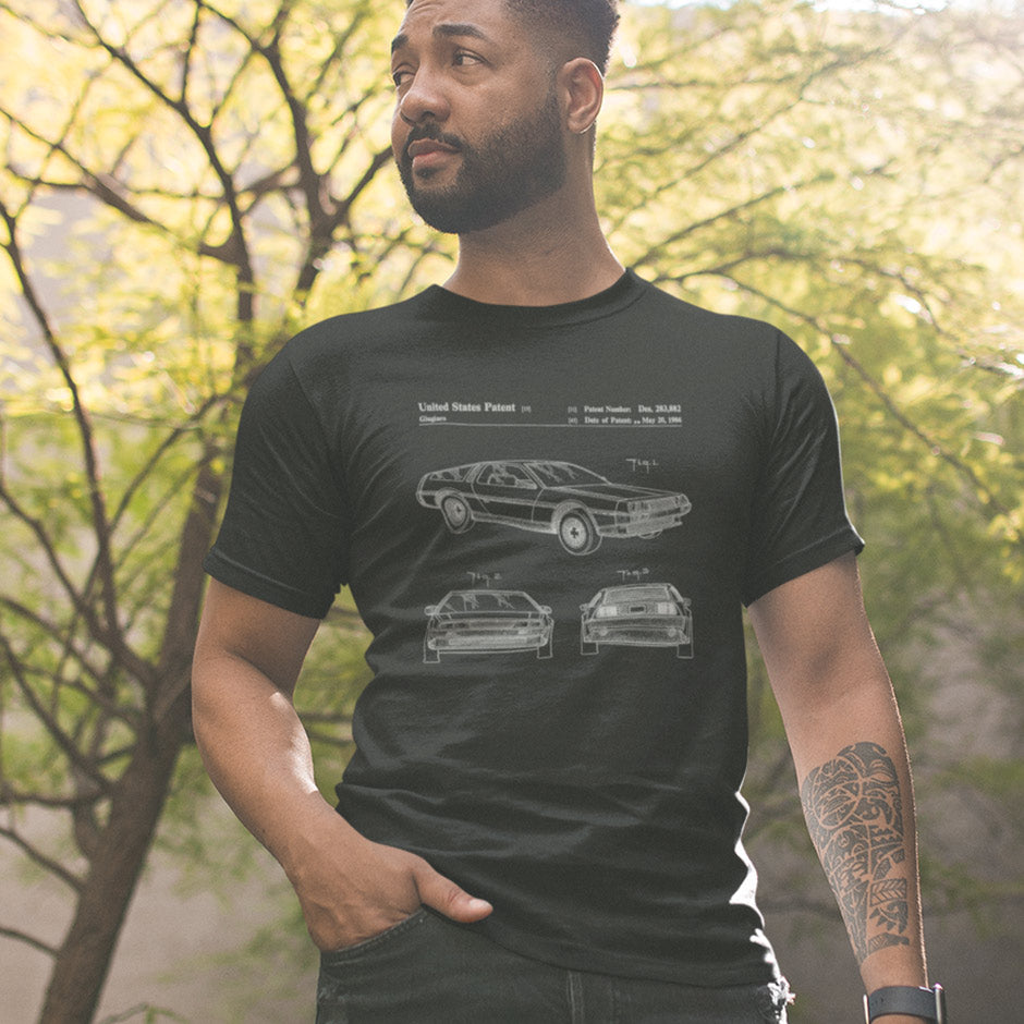 guy wearing the Dodo Tees car guy gift featuring a DMC-12 car. The unique automotive apparel shows 3 views of the car along with patent information.