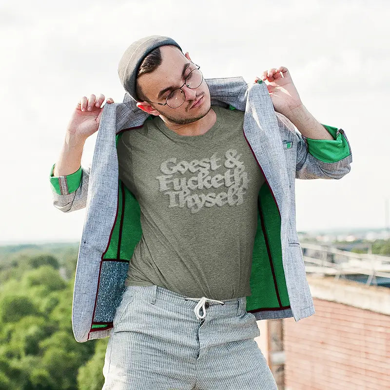 man wearing blazer and comical t shirt that reads goest and fucketh thyself