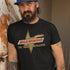  man leaning against wall wearing cult movie t shirt with brawndo logo. Dodo Tees movie apparel is side-seamed.