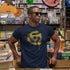 man in record store wearing dj t shirt with 45 rpm adapter design by dodo tees