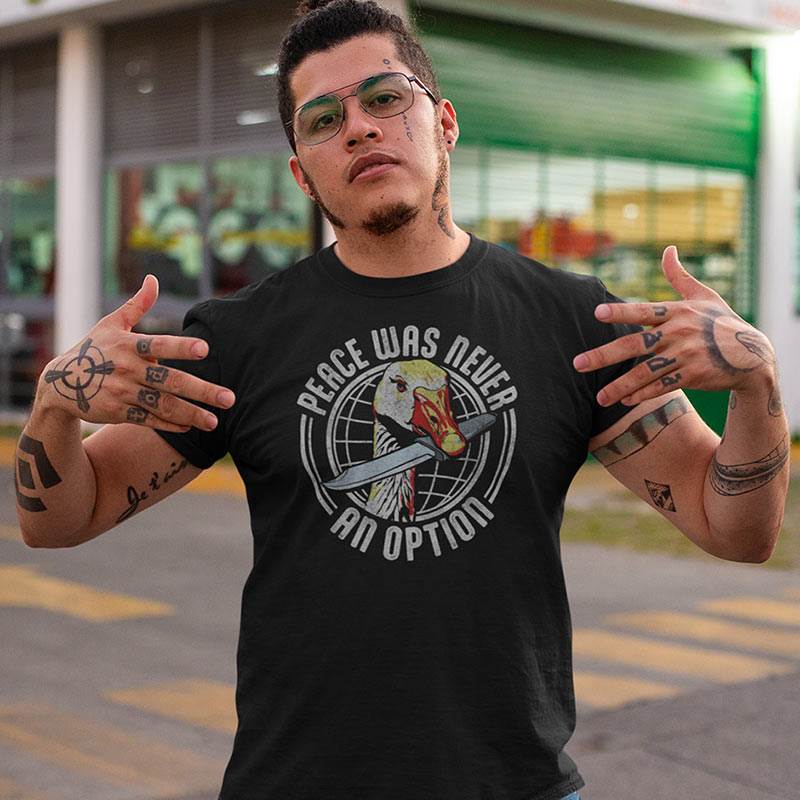 tattooed man wearing goose t shirt with peace was never an option graphic