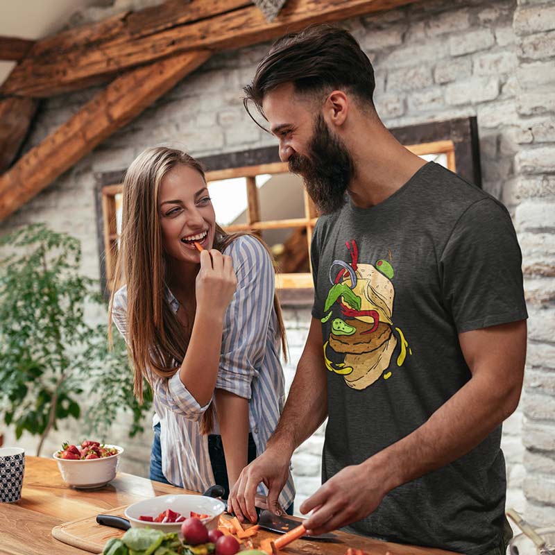 man cooking dinner wearing food t shirt with cheese burger graphic