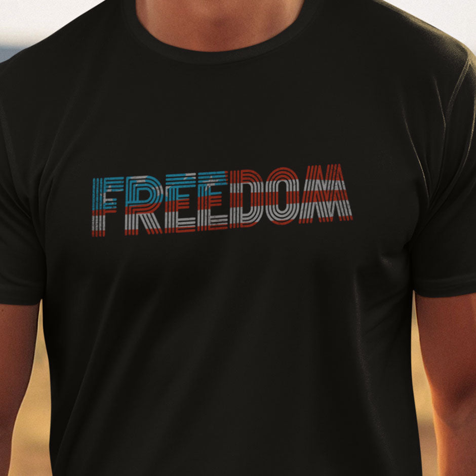 freedom t shirt that has a distressed American flag spelling out the word Freedom. The patriotic t shirts for men blend red white and blue color palette with unique typography.