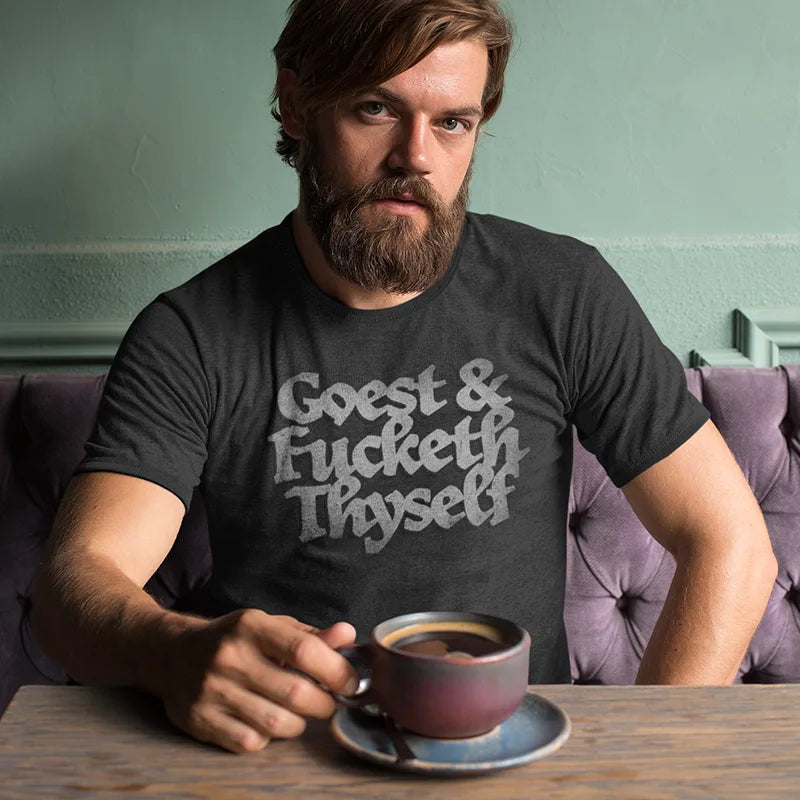 man at coffee shop wearing funny adult shirt with goest and fucketh thyself type