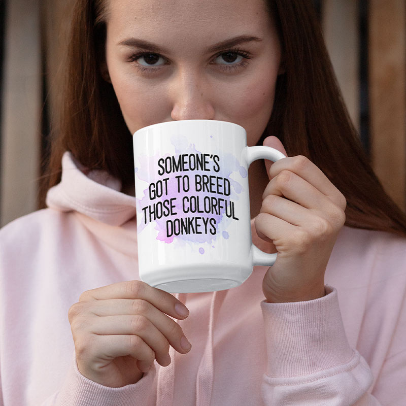 woman sipping from funny coffee mug with guillermo's pinata farm logo and quote