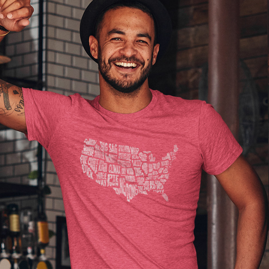 Funny patriotic t shirt for men featuring a map of the continental United States where each state is drawn out of a sexy city name. The America shirt is side-seamed for a great fit. 