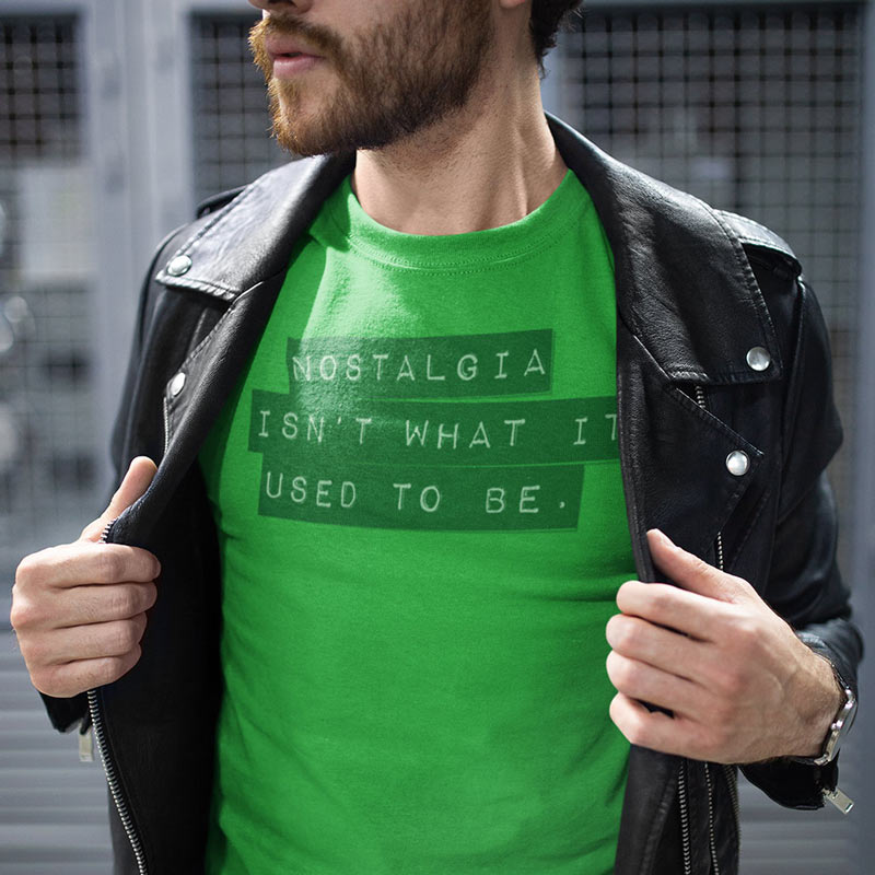 man in leather jacket wearing funny t shirt with nostalgia isn't what it used to be in label maker typography in green