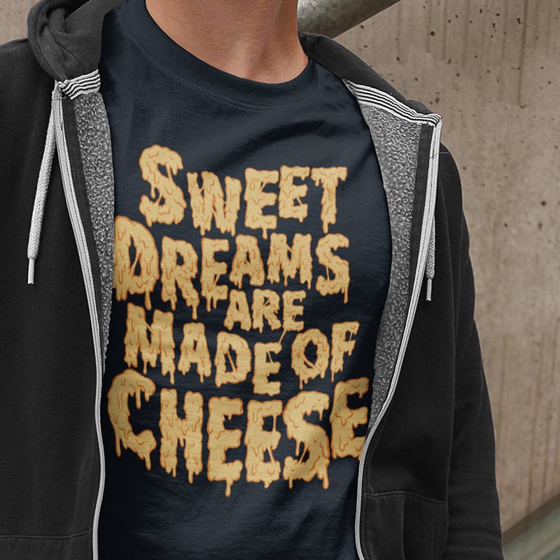 close up of man wearing funny t shirt with sweet dreams are made of cheese typography