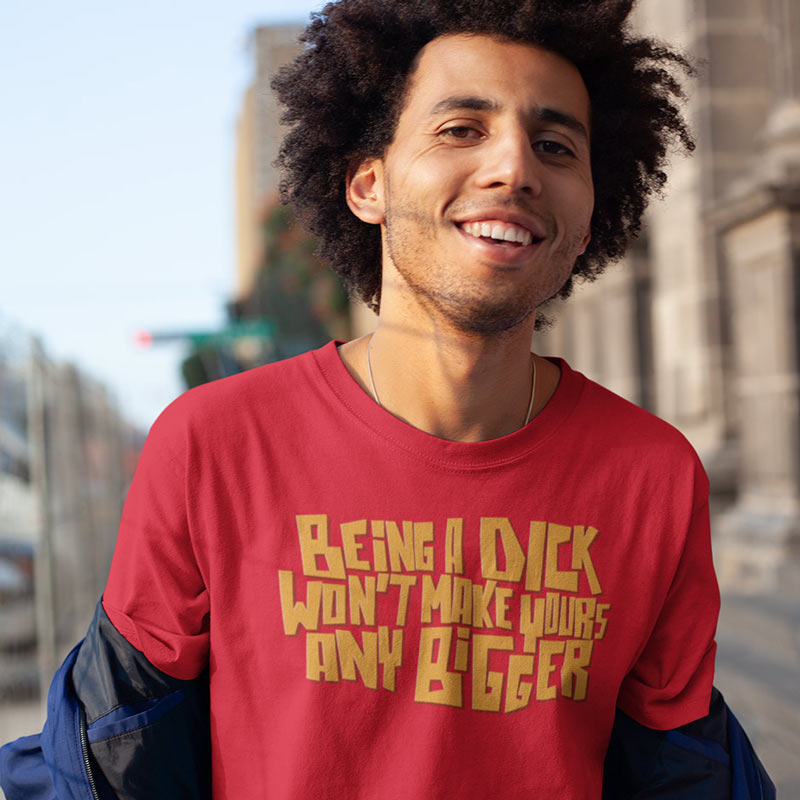 smiling man wearing gag gifts for men being a dick won't make yours any bigger t shirt