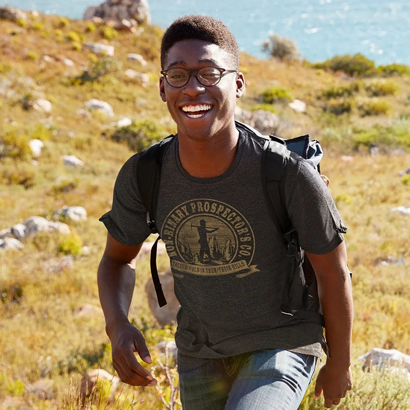 man hiking wearing gay gifts non-binary prospector's company t shirt