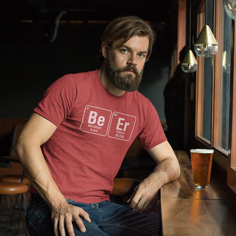 man wearing a geek t shirt featuring periodic table of elements Beryllium and Erbium spelling out Beer.