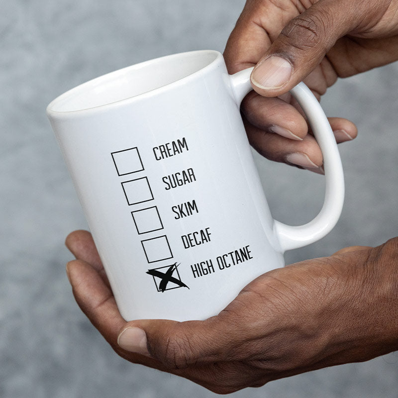 man holding his gift for dad hot rod mug showcasing the back design