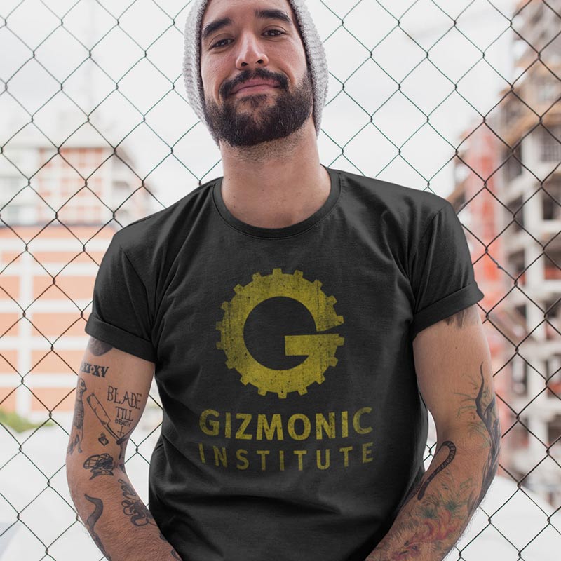 man by fence wearing movie inspired clothing t shirt with gizmonic institute distressed logo by dodo tees