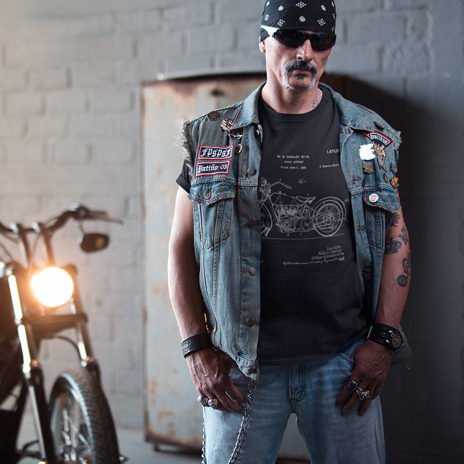 Guy in a vest wearing the the Harley shirts for men Dodo Tee with a 1928 Model JD patent. The motorcycle shirts are buttery soft and available in sizes S-3XL.