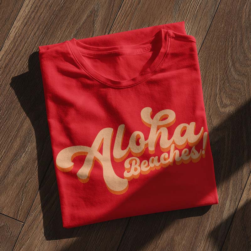 detail view of hawaii themed shirts with aloha beaches type in red by dodo tees