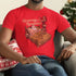 man in chair wearing holiday themed shirt with seasons beatings graphic