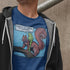 man wearing hoodie and meme t shirt with cartoon of a frog riding a squirrel saying there's no time to explain