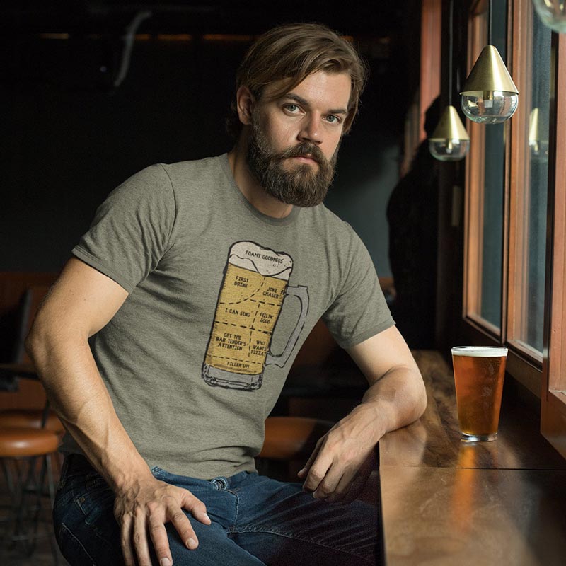 man in bar wearing mens funny t shirt with anatomy of beer illustration 