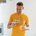 man in kitchen wearing mens funny t shirt with pudgy puffs graphic