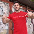 muscular man wearing a funny t shirt that says Titty bar. The red Offensive T Shirts are made by Dodo Tees.