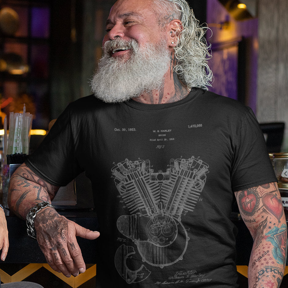 smiling man wearing a Dodo Tees mens Harley shirt featuring the 1923 Harley Model 23 JS engine patent. Motorcycle Shirts come with free shipping.