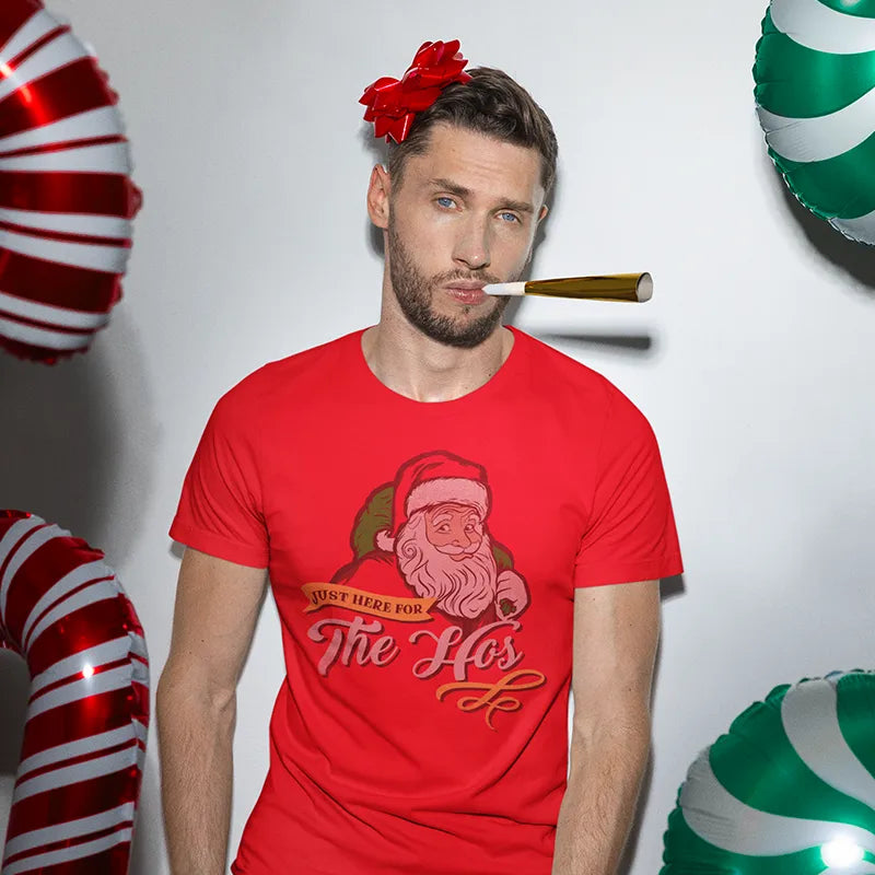 man at christmas party wearing mens xmas shirt with just here for the hos illustration