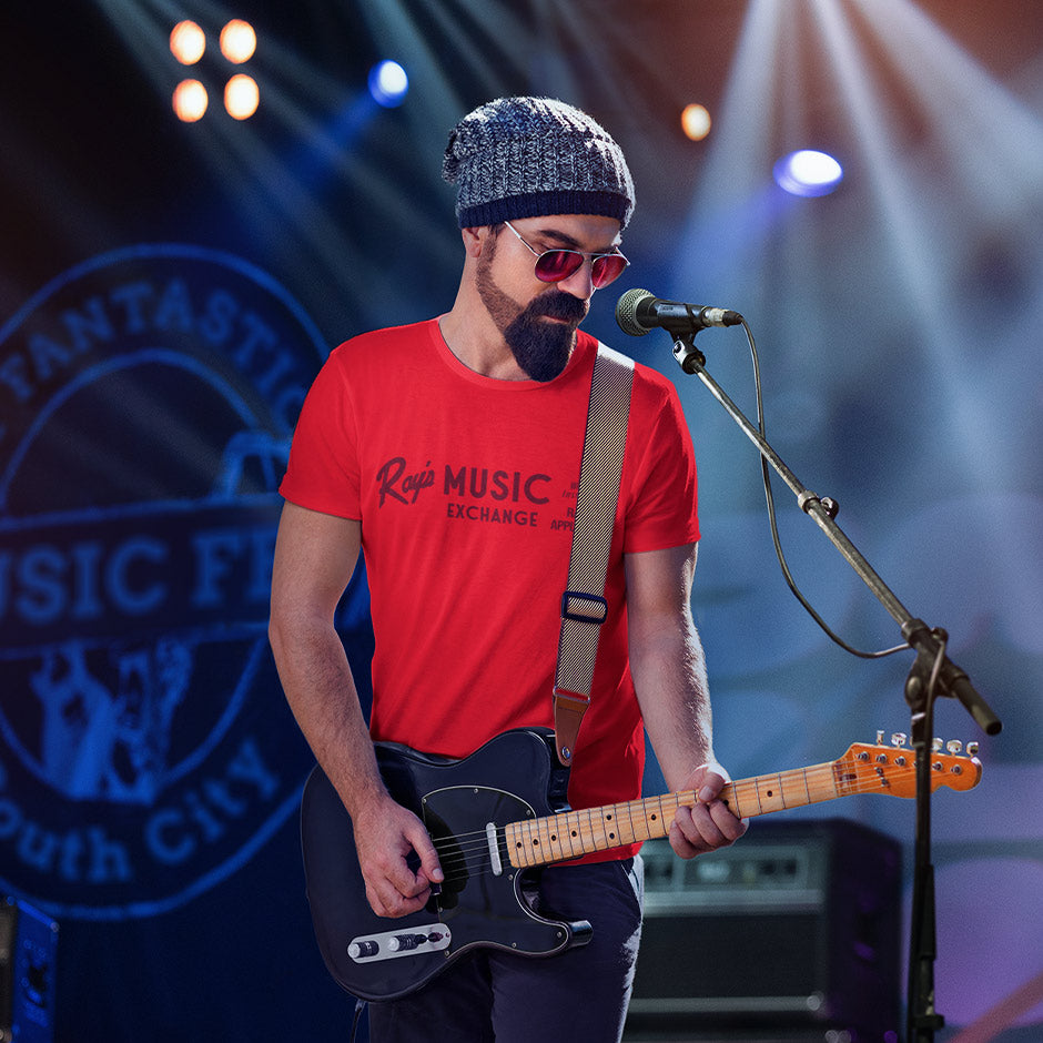 guitar player wearing the red Dodo Tees Movie T Shirt that featuring the Rays Music Exchange logo. The retro music shirts are side seamed.